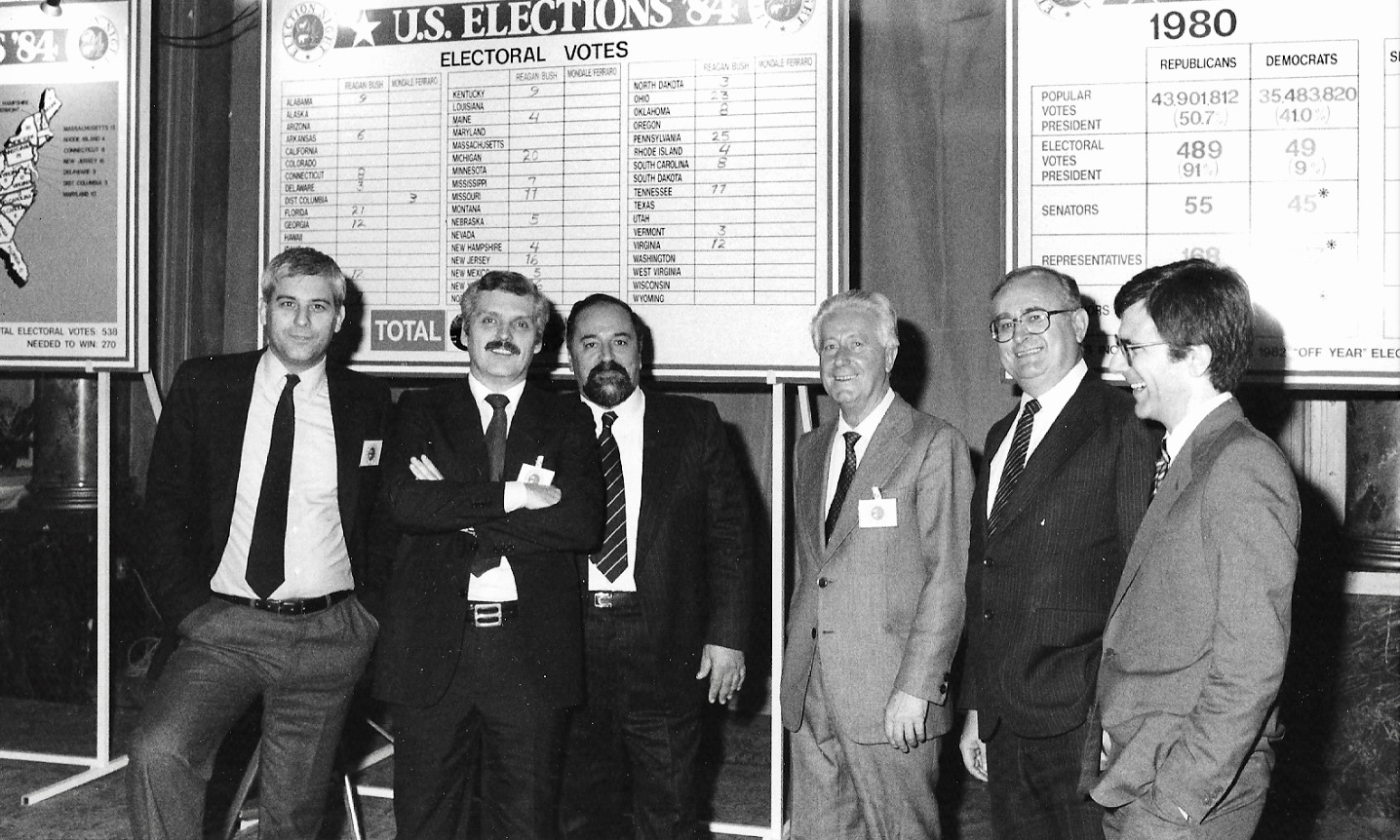 Photo caption: Election Night party at the Excelsior Hotel in Rome, 1984. L-r: David Wagner, Michael Canning, Bruno Scarfi, Enrico Chini, Leonard J. Baldyga, Joe B. Johnson.